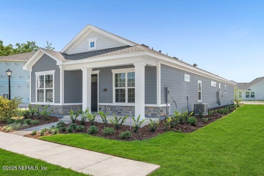Front exterior of a new home in Brookside at Shearwater, St. Augustine, FL, highlighting curb appeal (Image 2). Front exterior of a new home in Brookside at Shearwater, St. Augustine, FL, highlighting curb appeal (Image 2).