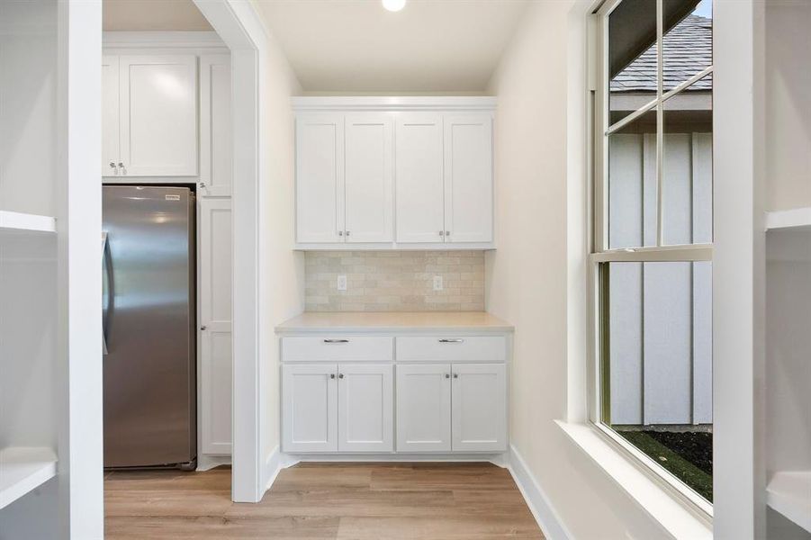 Walk-in pantry with coffee bar and shelves Walk-in pantry with coffee bar and shelves