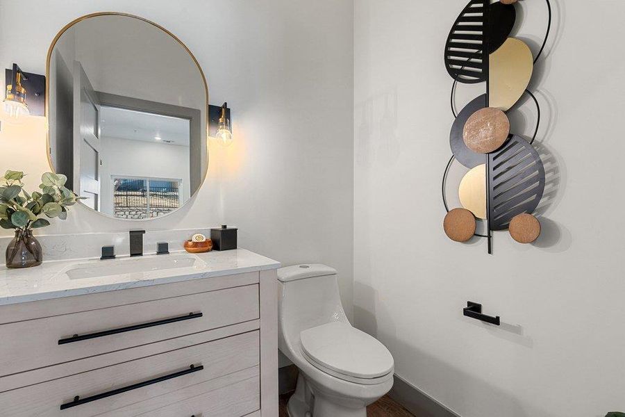 Guest Powder Room with vanity and toilet, in main living area