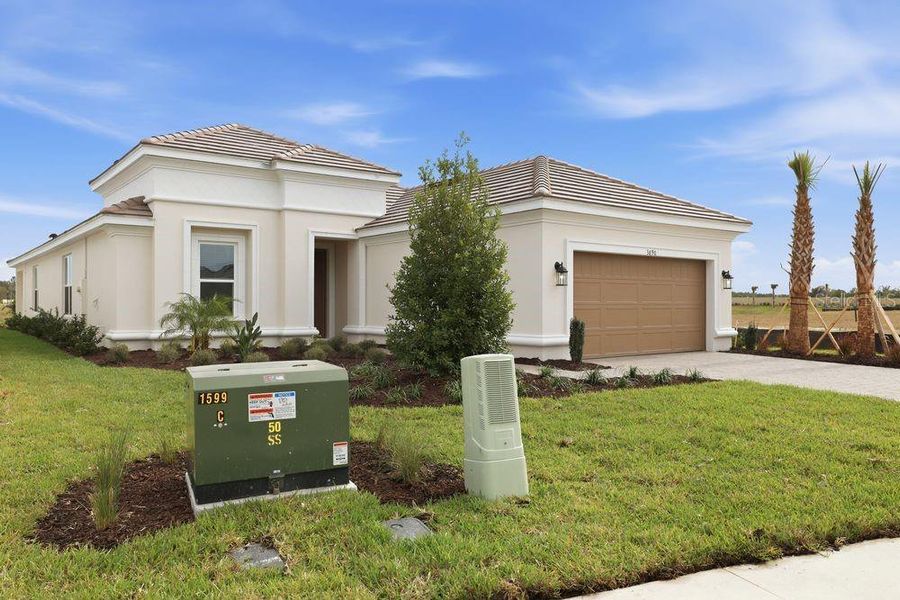 Front exterior of a new home in Esplanade at Wiregrass Ranch, Wesley Chapel, FL, highlighting curb appeal (Image 2).