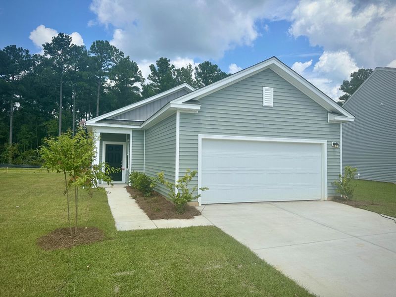 Front exterior of a new home in Watson Hill, Summerville, SC, highlighting curb appeal (Image 1). Front exterior of a new home in Watson Hill, Summerville, SC, highlighting curb appeal (Image 1).