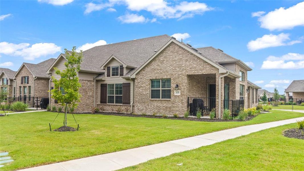 View of front of property with a front yard