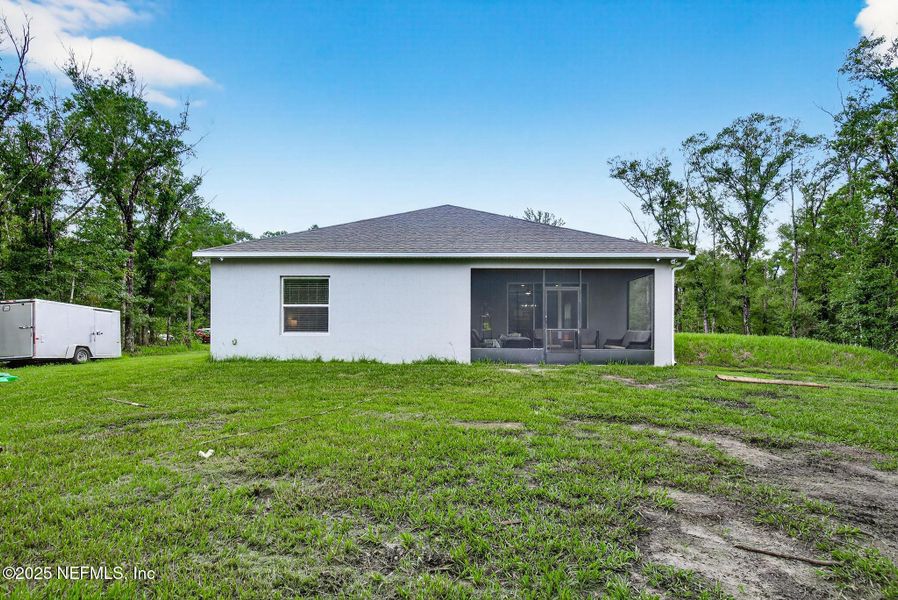 Front exterior of a new home in Flagler Estates, Hastings, FL, highlighting curb appeal (Image 20).