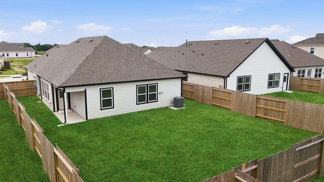Exterior details and patio area of a home in Creekhaven, Iowa Colony (Image 29). Exterior details and patio area of a home in Creekhaven, Iowa Colony (Image 29).
