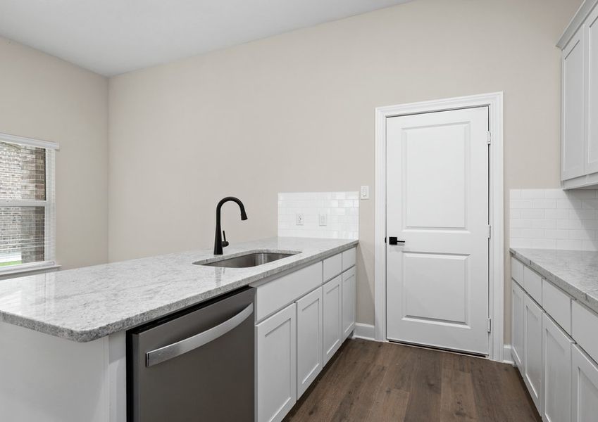 The kitchen looks out to the dining area.