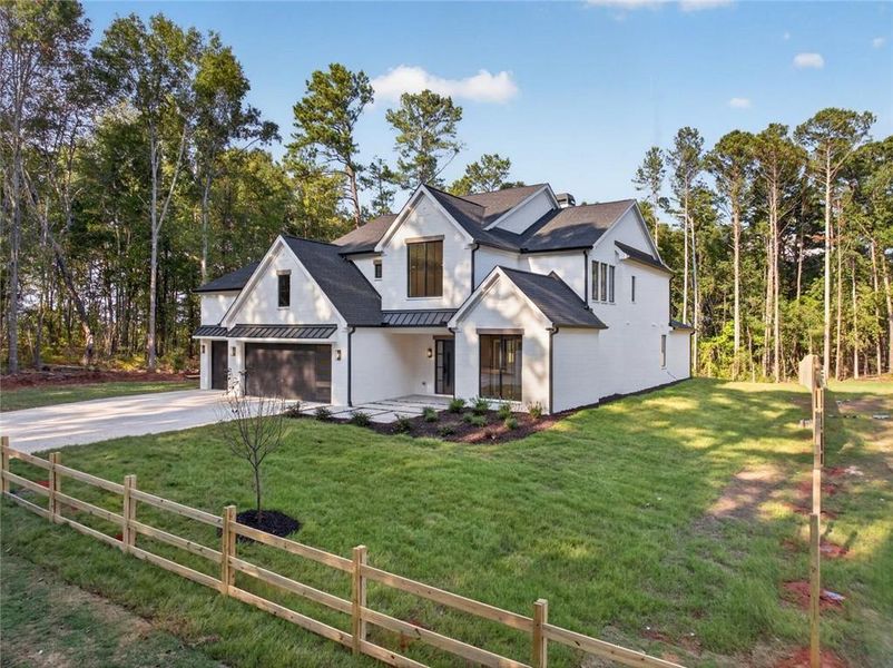 Front exterior of a new home in , Loganville, GA, highlighting curb appeal (Image 27). Front exterior of a new home in , Loganville, GA, highlighting curb appeal (Image 27).