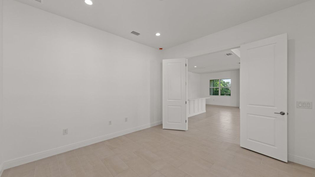 Spacious, unfurnished interior of a new home in Verandah Real Estate and Homes for Sale in Fort Myers, FL - Neal Communities, Fort Myers (Image 24).