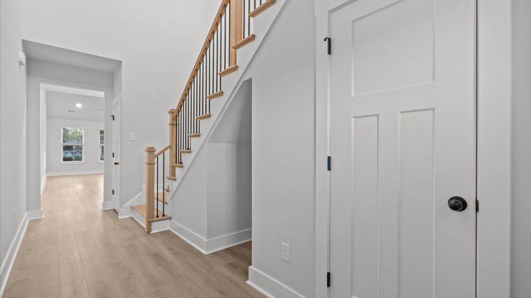 Memorable arrival experience with hardwood floors and elegant trim in the foyer Memorable arrival experience with hardwood floors and elegant trim in the foyer