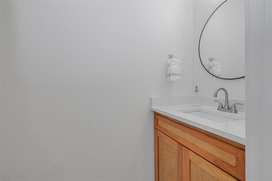 1/2 Bathroom with vanity on the 1st level