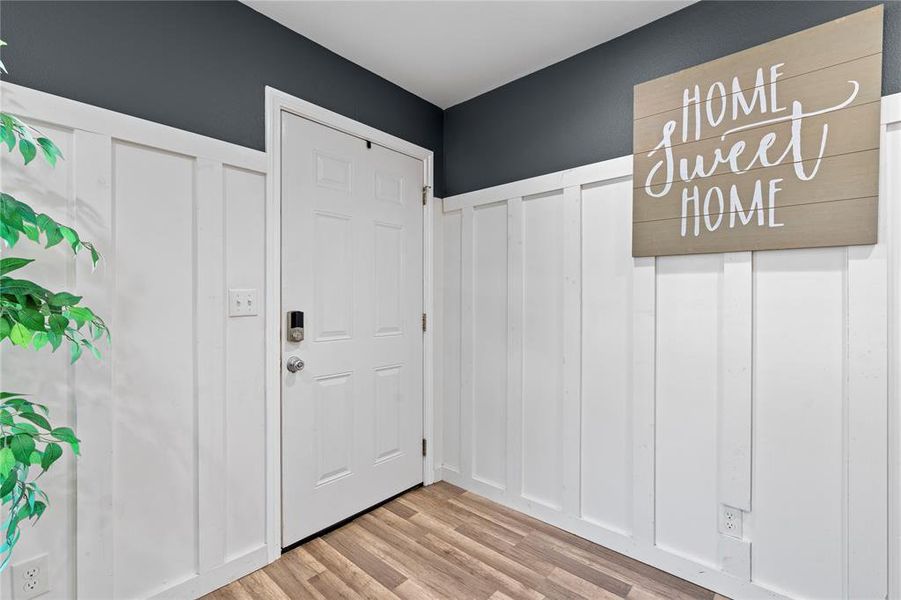 Entryway with light hardwood / wood-style floors