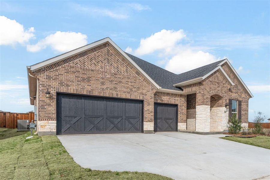 Front exterior of a new home in Villages of Creekwood, Frisco, TX, highlighting curb appeal (Image 22).