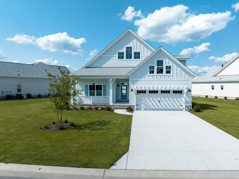 Representative exterior photo of a completed home built from the Kauai by Bill Clark Homes in The Sanctuary at Sunset Beach, Sunset Beach, NC (Image 18). Representative exterior photo of a completed home built from the Kauai by Bill Clark Homes in The Sanctuary at Sunset Beach, Sunset Beach, NC (Image 18).