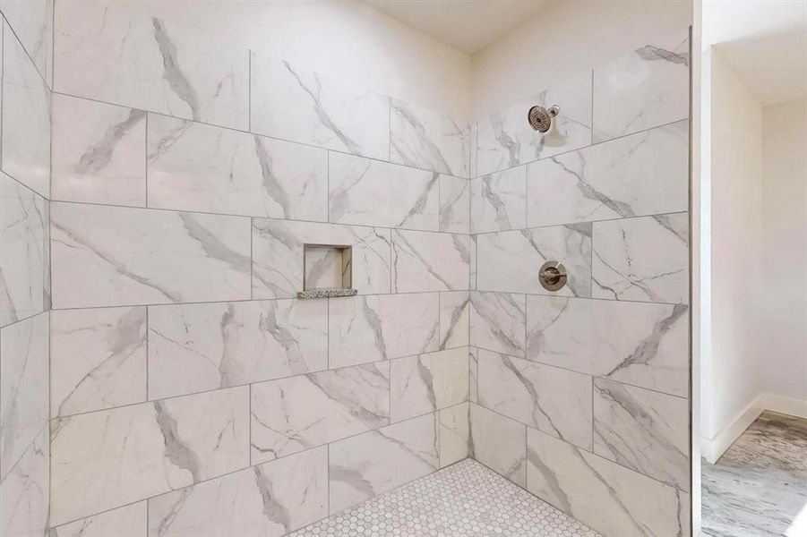 Bathroom with tiled shower