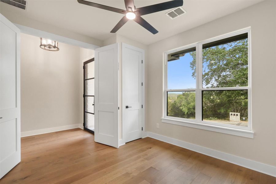 Unfurnished bedroom with light wood-type flooring, visible vents, and baseboards Unfurnished bedroom with light wood-type flooring, visible vents, and baseboards