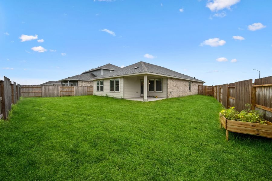 Exterior details and patio area of a home in Heights of Barbers Hill, Mont Belvieu (Image 22).
