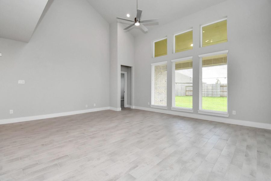 Experience another perspective of the open-concept family room – envision hosting guests in the heart of the home or relishing a cozy movie night in this inviting and relaxing setting. Sample photo of completed home with similar floor plan. Actual colors and selections may vary. Experience another perspective of the open-concept family room – envision hosting guests in the heart of the home or relishing a cozy movie night in this inviting and relaxing setting. Sample photo of completed home with similar floor plan. Actual colors and selections may vary.