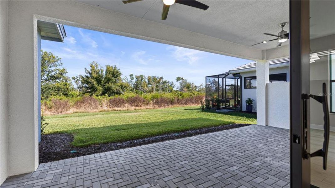 Exterior details and patio area of a home in Cresswind Lakewood Ranch, Lakewood Ranch (Image 3).