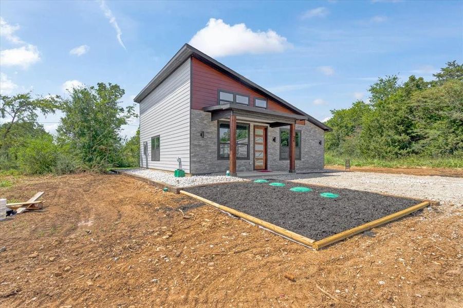 Front exterior of a new home in , Gordonville, TX, highlighting curb appeal (Image 19). Front exterior of a new home in , Gordonville, TX, highlighting curb appeal (Image 19).