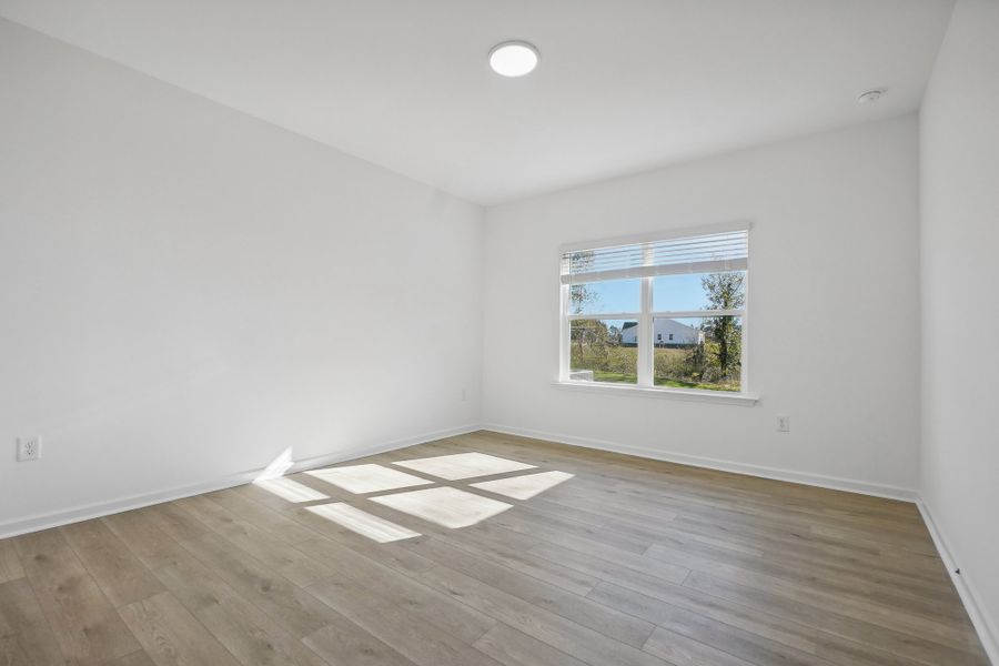 Representative unfurnished interior of a home built from the Macon by Ashton Woods in Rowland's Grant, Fuquay Varina (Image 35).