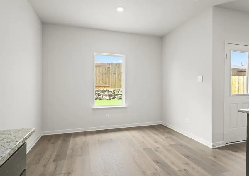 The dining room has a large window. The dining room has a large window.