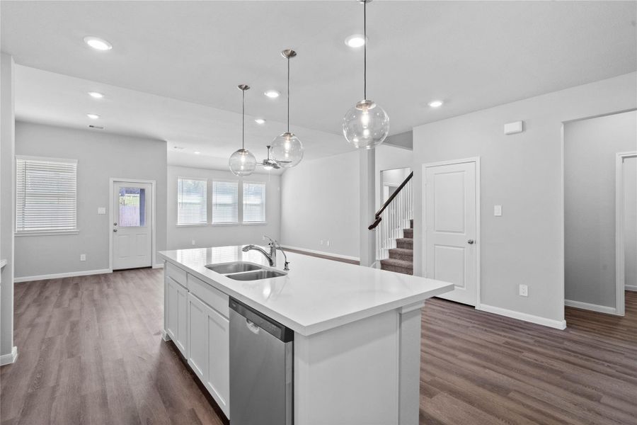 From the expansive kitchen island, enjoy seamless sightlines across the open-concept living and dining areas, making entertaining a breeze and ensuring you're never far from the conversation.