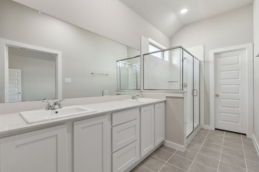 Primary Bathroom in the Claret home plan by Trophy Signature Homes – REPRESENTATIVE PHOTO