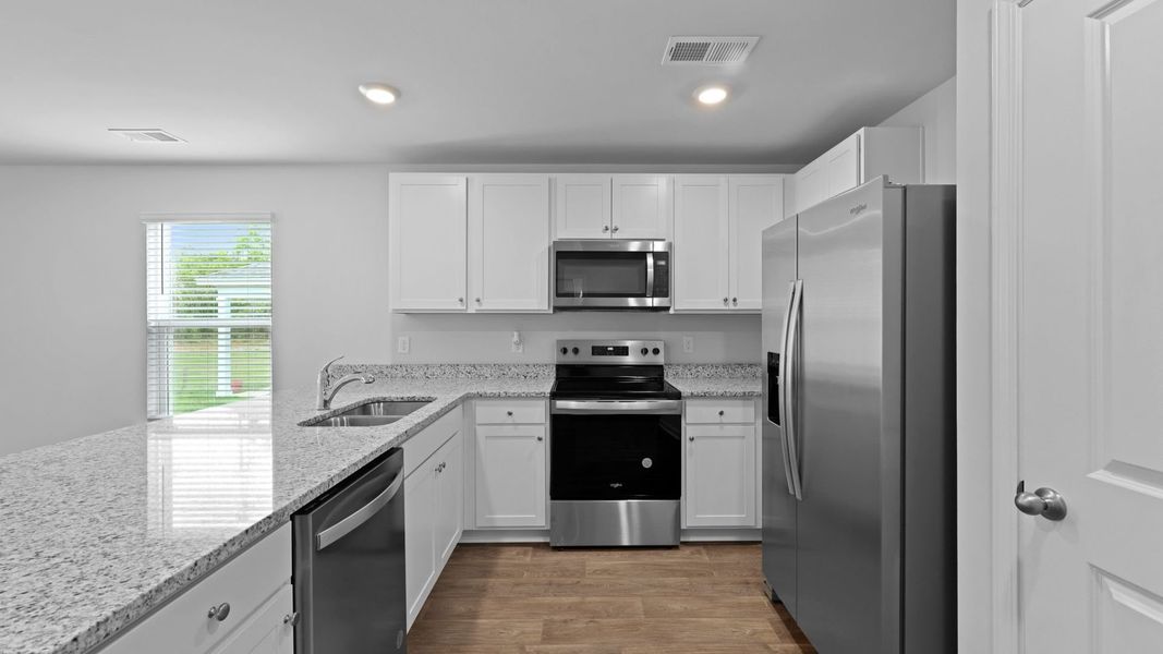 Representative furnished interior of a home built from the HELENA by D.R. Horton in Center Pointe, Santee (Image 4).