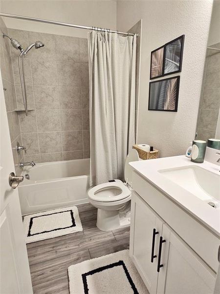 Upstairs full bathroom with linen closet.