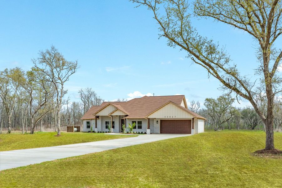 Front exterior of a new home in , Richwood, TX, highlighting curb appeal (Image 26).