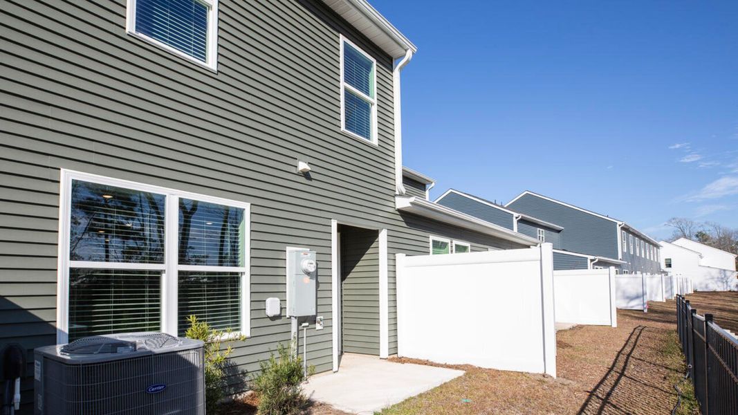 Exterior details and patio area of a home in Waterside Townhomes, Surf City (Image 2). Exterior details and patio area of a home in Waterside Townhomes, Surf City (Image 2).
