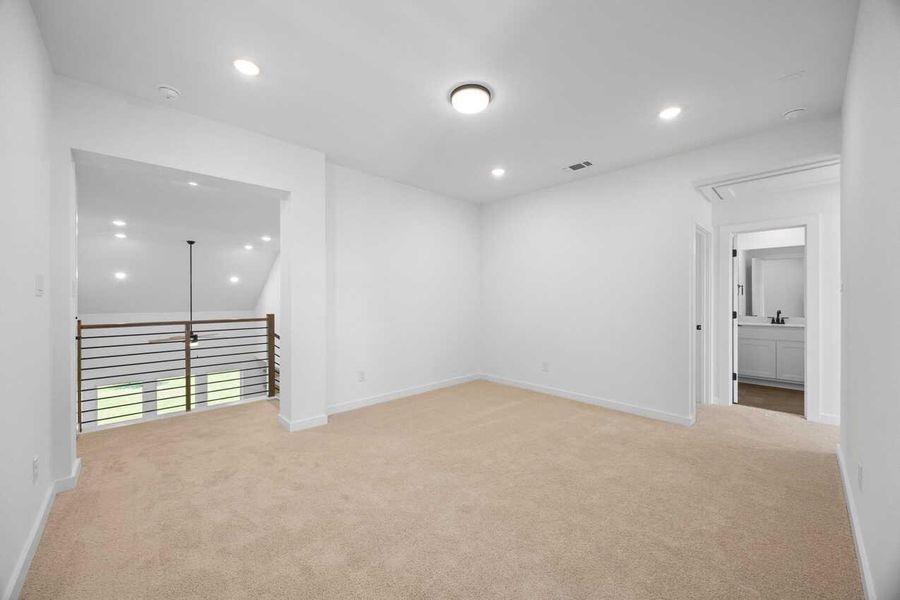 Spare room featuring attic access, recessed lighting, and light colored carpet Spare room featuring attic access, recessed lighting, and light colored carpet