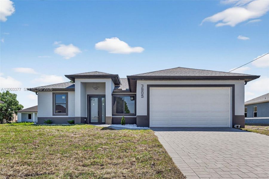 Front exterior of a new home in , Lehigh Acres, FL, highlighting curb appeal (Image 26).