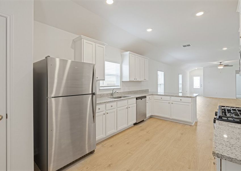Kitchen with white cabinets and stainless steel appliances