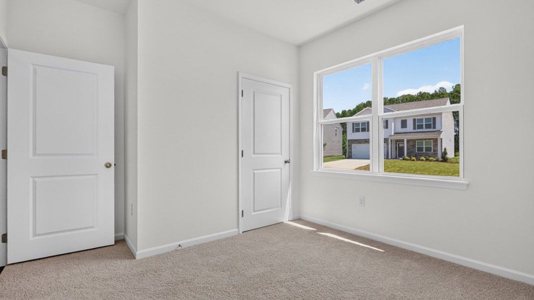 Spacious, unfurnished interior of a new home in The Grove at Matthews Landing, Fuquay Varina (Image 22).