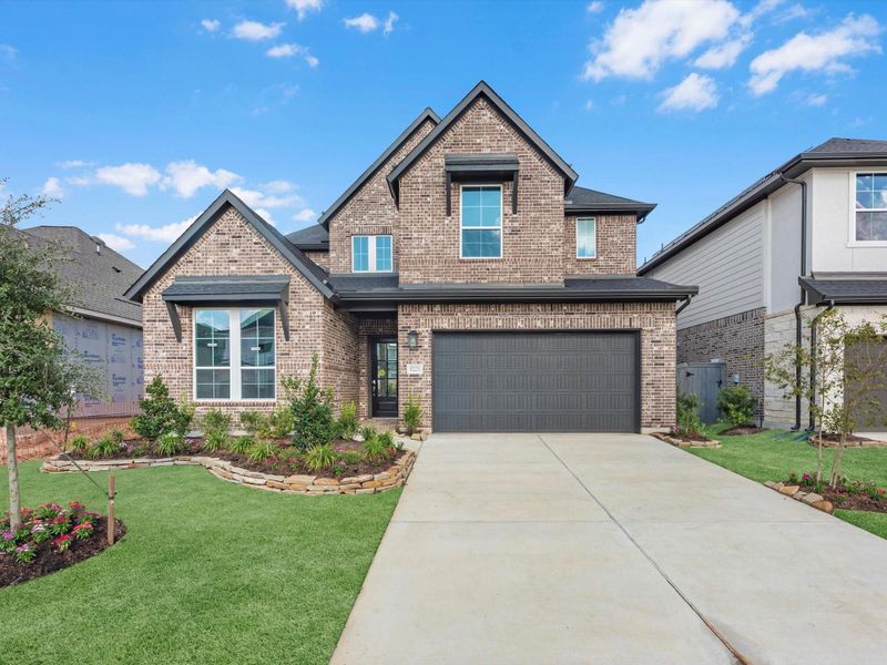 Front exterior of a new home in Jubilee 50′, Hockley, TX, highlighting curb appeal (Image 2). Front exterior of a new home in Jubilee 50′, Hockley, TX, highlighting curb appeal (Image 2).