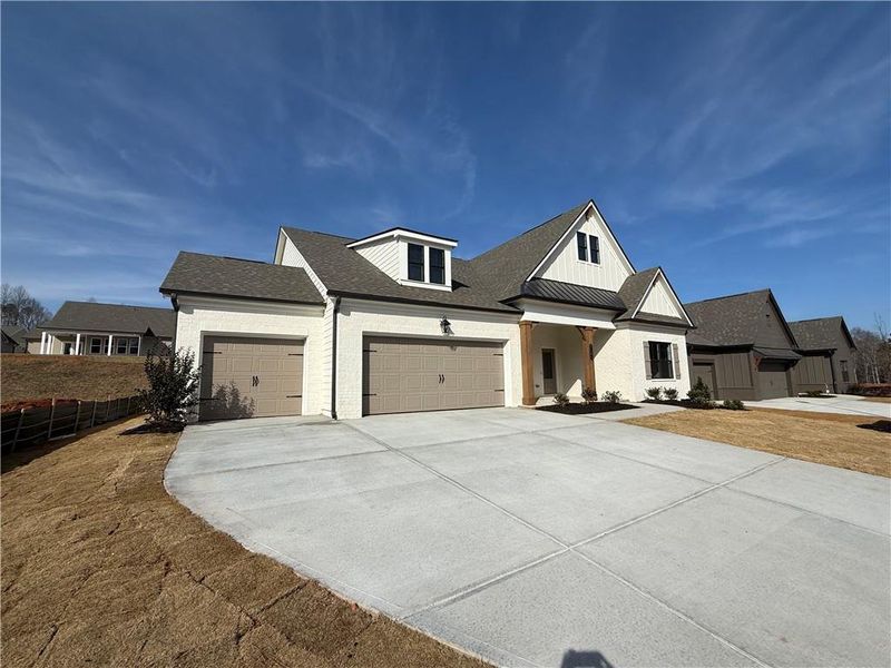 Front exterior of a new home in Ponderosa Farms Reserve, Gainesville, GA, highlighting curb appeal (Image 27).