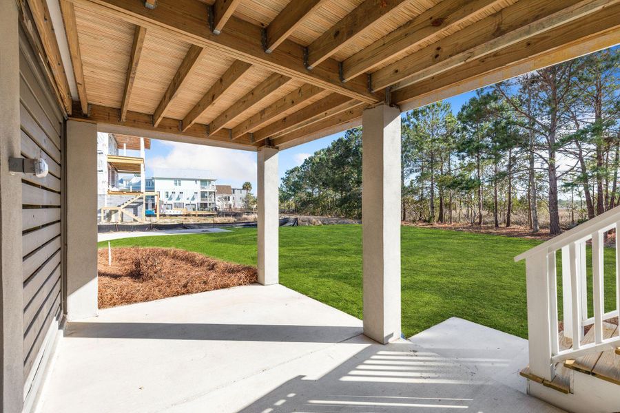 Exterior details and patio area of a home in Rivercroft, Awendaw (Image 37).