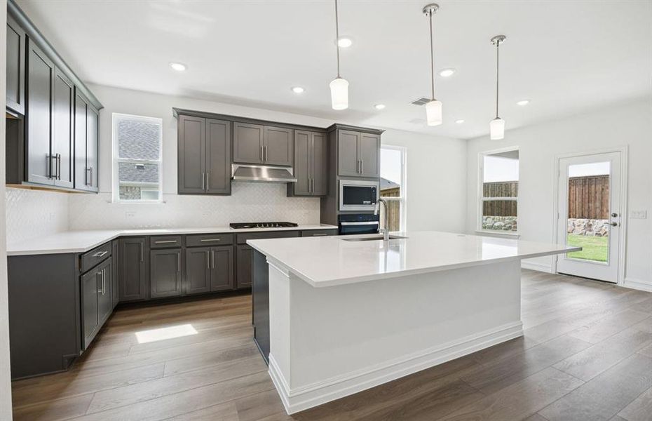 Spacious Kitchen with eat-in bar top island
