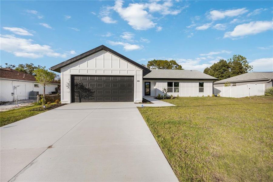 Front exterior of a new home in , North Port, FL, highlighting curb appeal (Image 19).