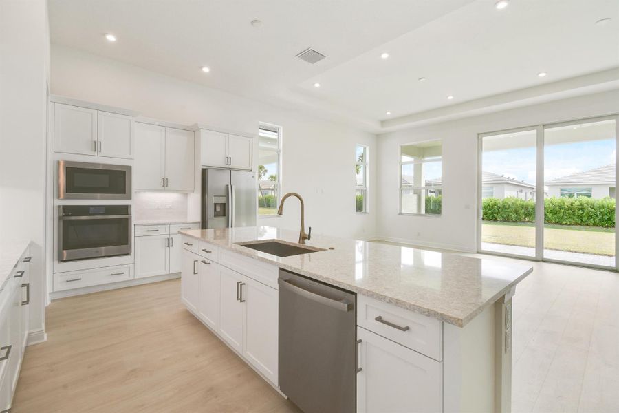 Furnished interior view inside a new home in PGA Village Verano, Port St. Lucie (Image 7).