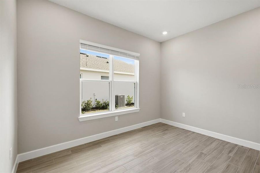 Spacious, unfurnished interior of a new home in Esplanade at Westview, Kissimmee (Image 37).