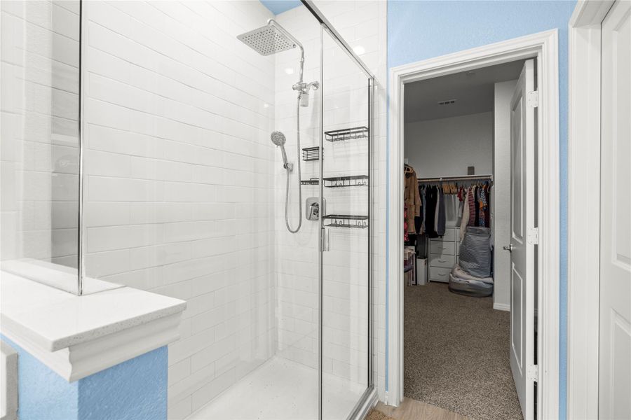 Modern shower with sleek glass enclosure and a convenient rain shower head.