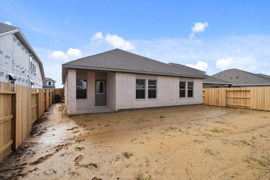 Exterior details and patio area of a home in Windrose Green, Angleton (Image 23).