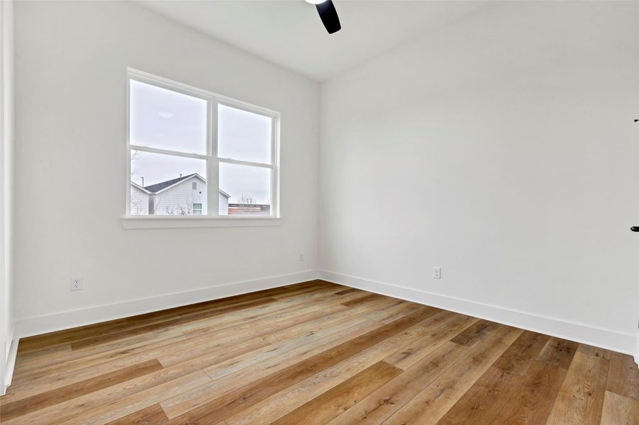 Cozy secondary bedroom on the second floor, featuring beautiful wood floors that add warmth and character to the space. Cozy secondary bedroom on the second floor, featuring beautiful wood floors that add warmth and character to the space.