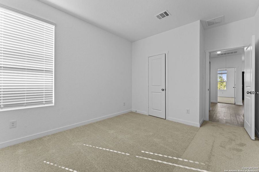 Spacious, unfurnished interior of a new home in Waterwheel: Coastline Collection, San Antonio (Image 13).