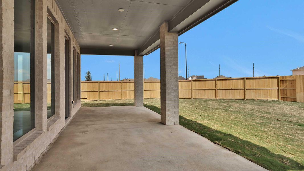 Exterior details and patio area of a home in Elyson 55', Katy (Image 2).