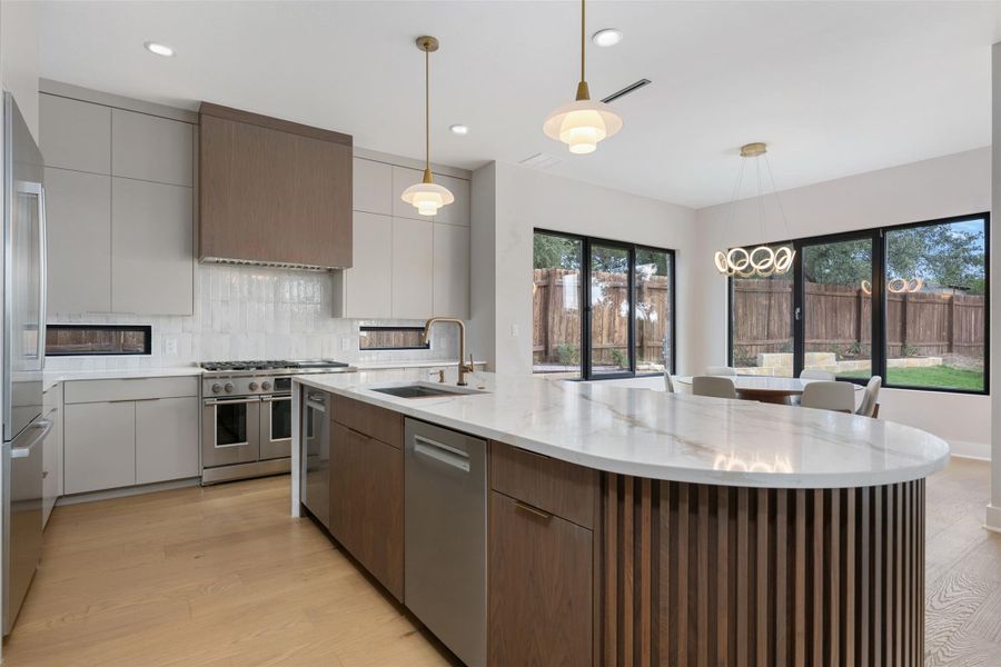 Gorgeous kitchen open to dining and family room with lots of natural light and views. Gorgeous kitchen open to dining and family room with lots of natural light and views.