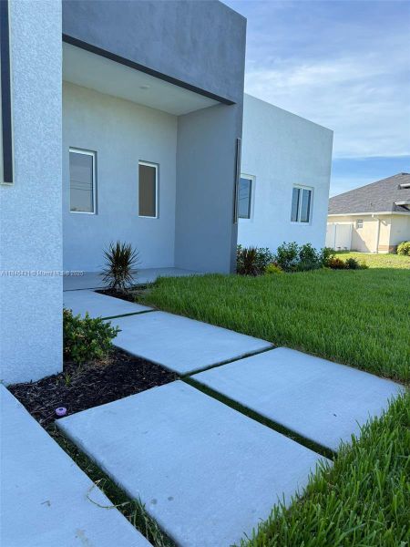 Front exterior of a new home in , Cape Coral, FL, highlighting curb appeal (Image 21).