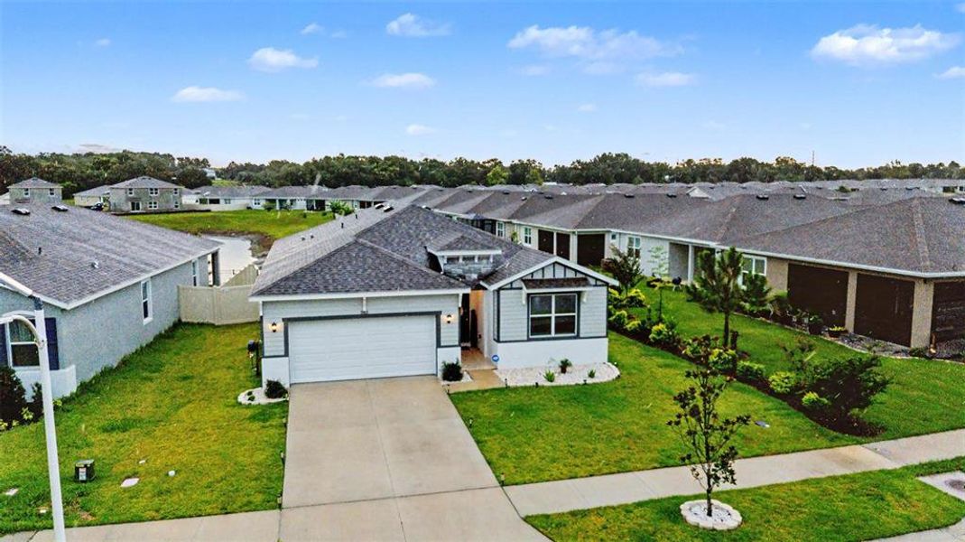 Front exterior of a new home in Abbott Park, Zephyrhills, FL, highlighting curb appeal (Image 25).