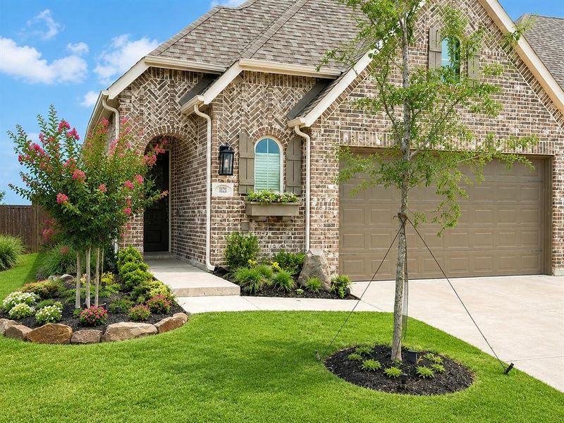 Front exterior of a new home in Bel Air Village, Sherman, TX, highlighting curb appeal (Image 2). Front exterior of a new home in Bel Air Village, Sherman, TX, highlighting curb appeal (Image 2).